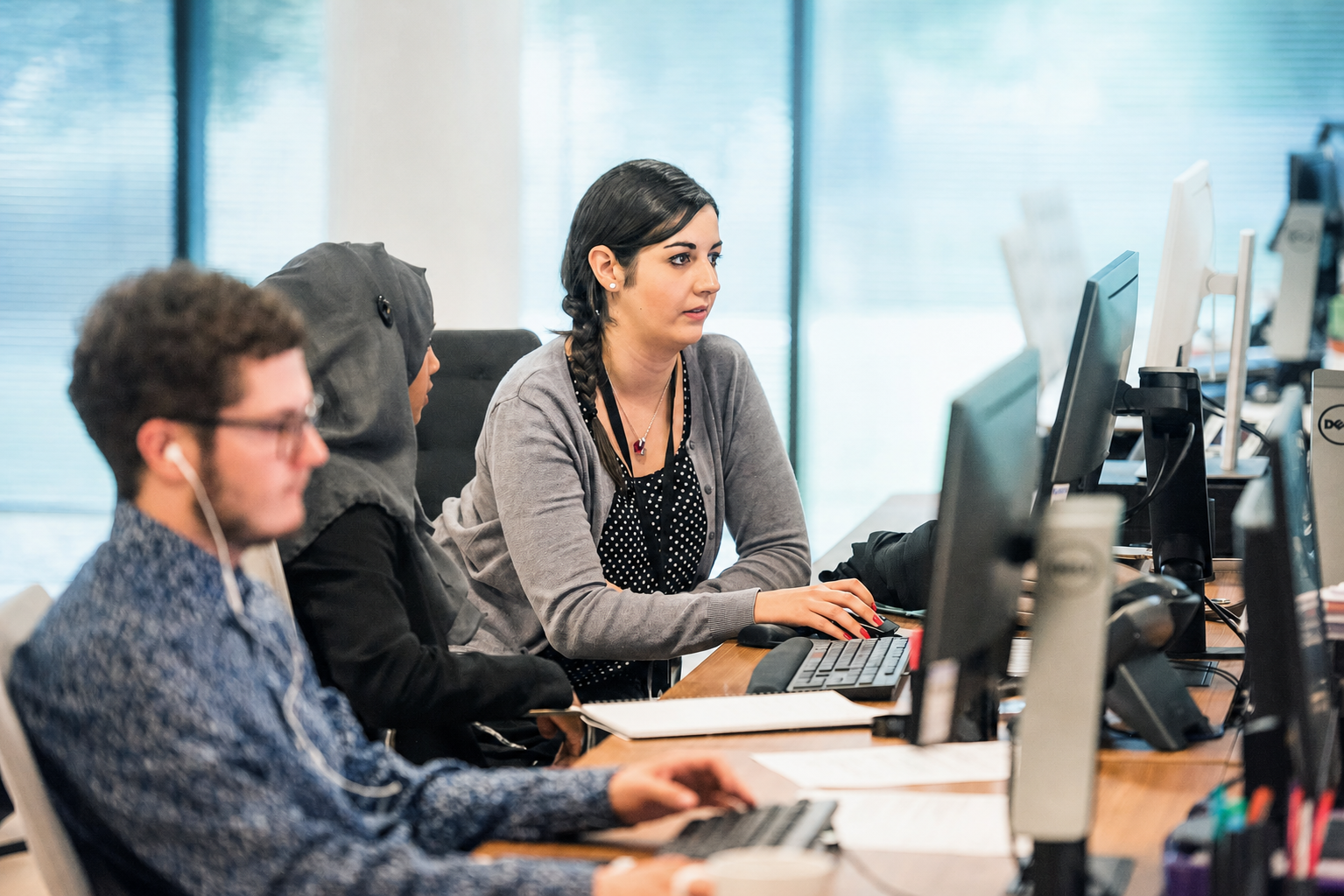Recruitment consultants working at their desks